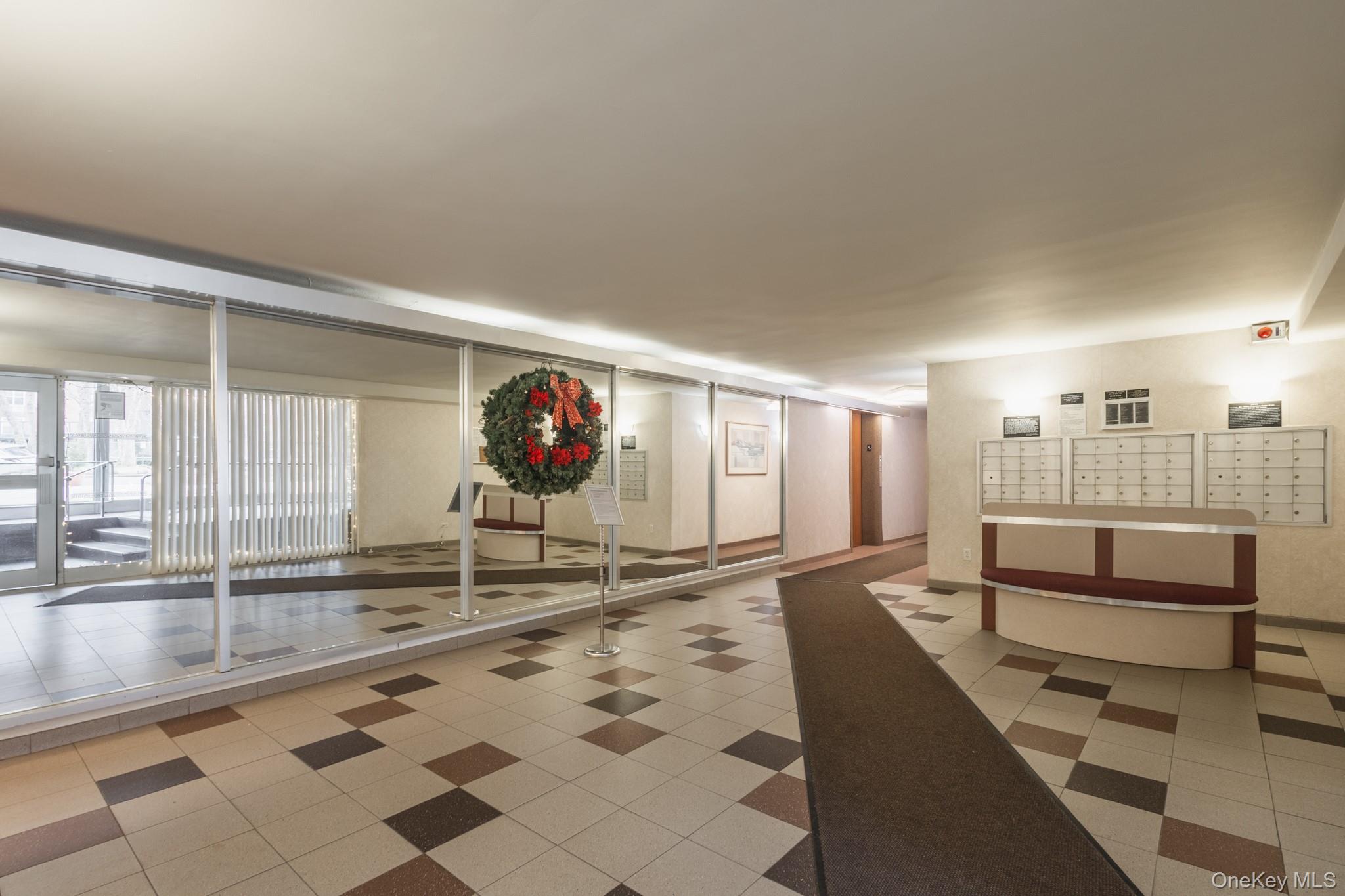 209-25 18th Avenue, Unit 3F Queens, NY 11360 - Photo 25 of 28 a living room with a couch and a table
