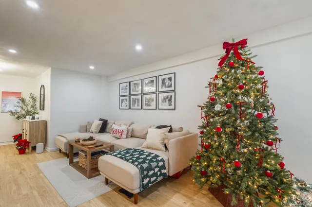 a living room with furniture and flowers