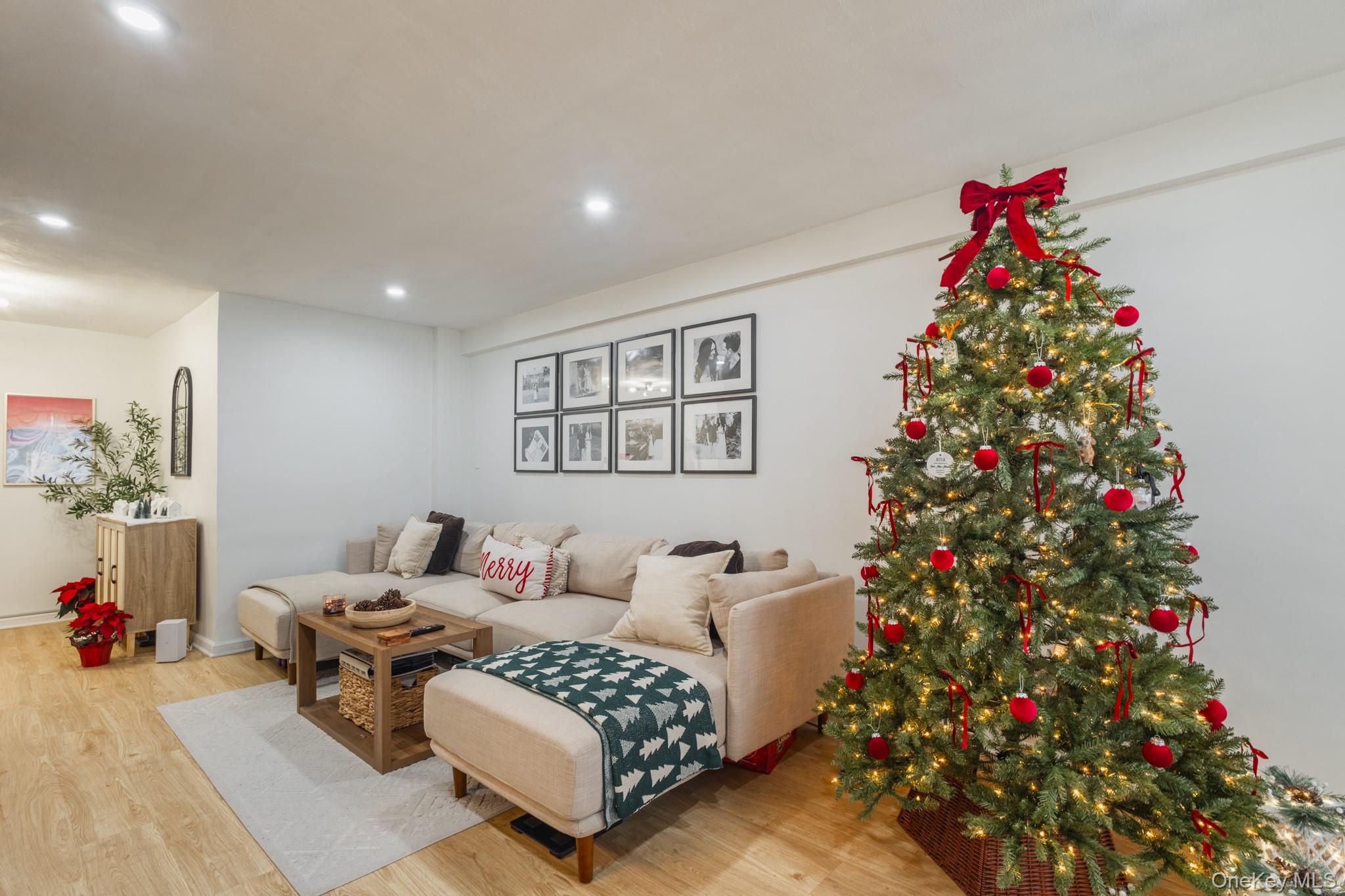 209-25 18th Avenue, Unit 3F Queens, NY 11360 - Photo 4 of 28 a living room with furniture and flowers
