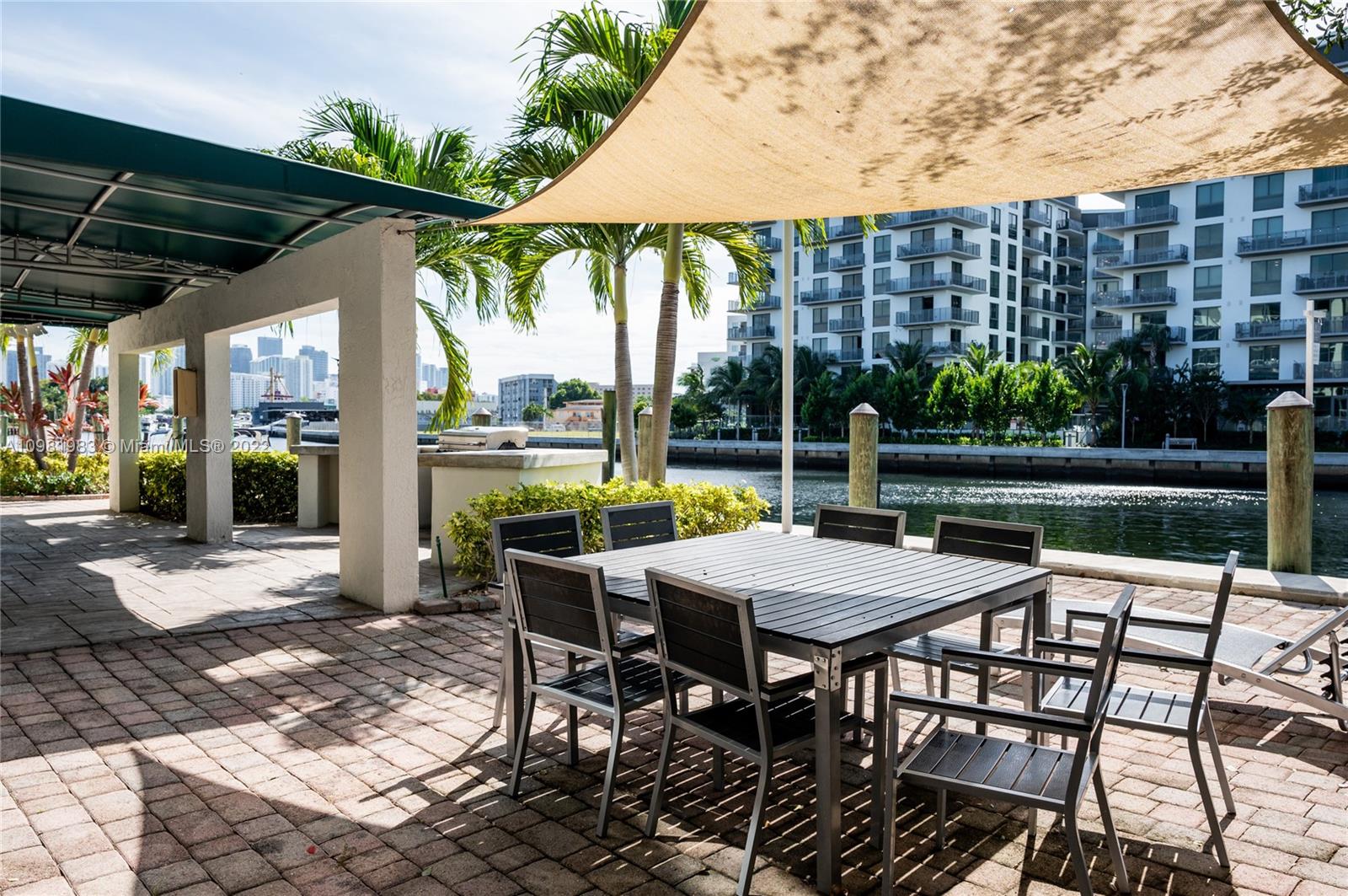 Spring Garden Miami, FL 33136 - Photo 26 of 39 a view of a patio with a table chairs and backyard
