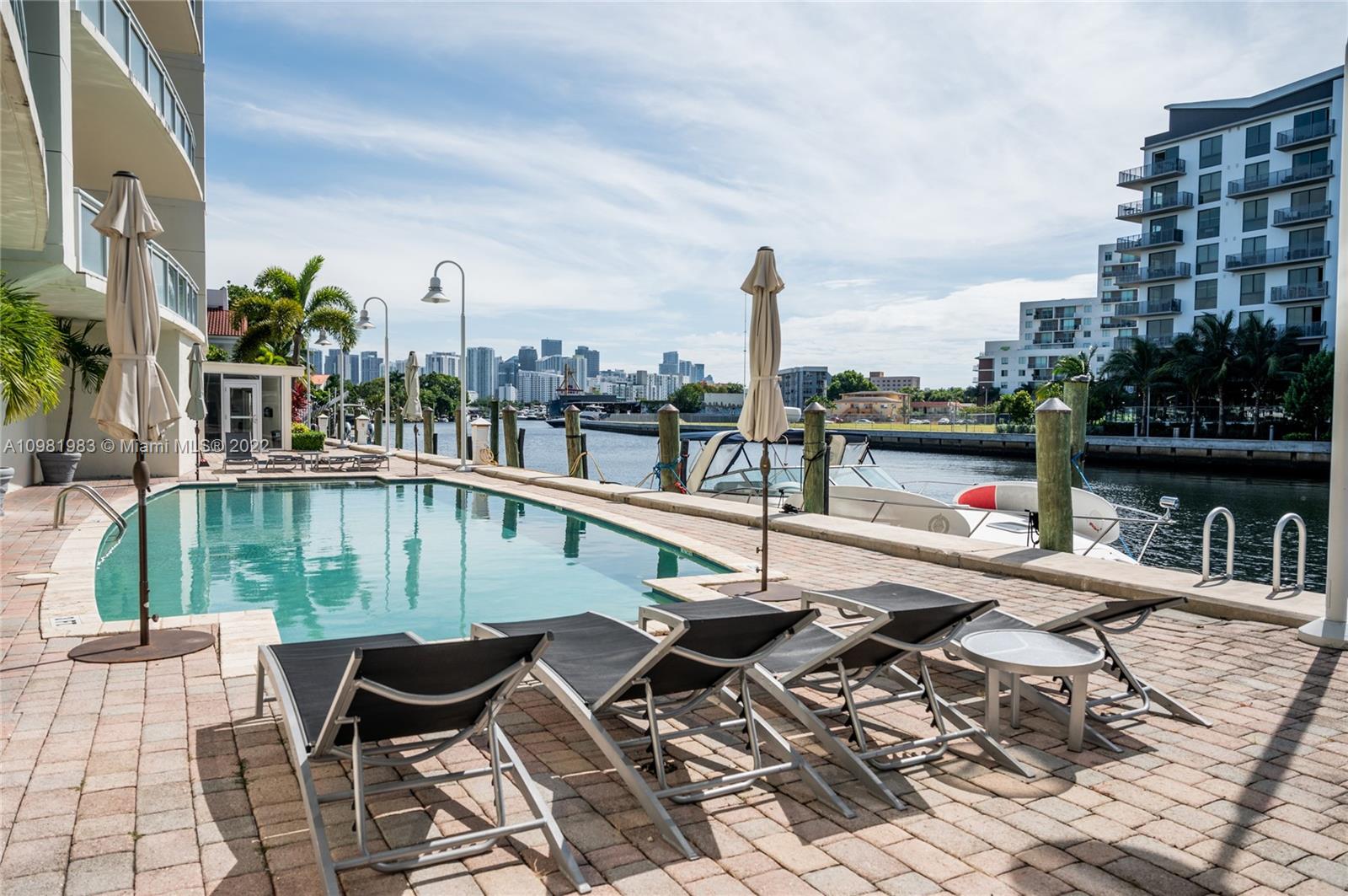 Spring Garden Miami, FL 33136 - Photo 30 of 39 a view of swimming pool with outdoor seating and city view