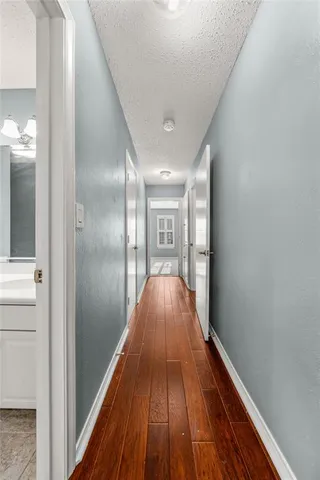 a view of gallery with wooden floor