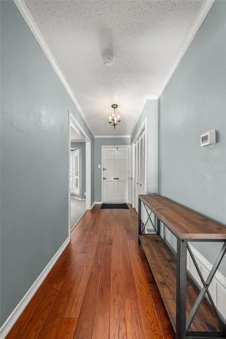 a view of a room with wooden floor and window