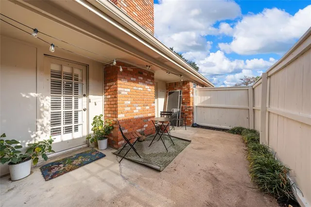 a balcony with furniture and flowers