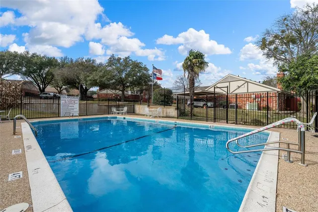 a view of a swimming pool with a lounge chairs