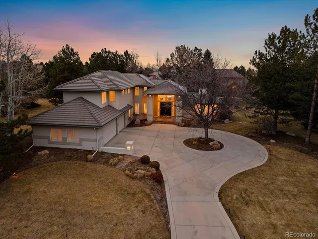 a view of a house with backyard porch and sitting area