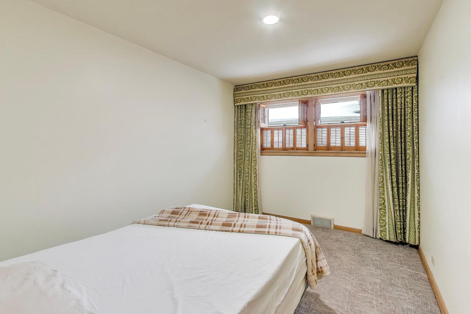 820 North Delphia Avenue Park Ridge, IL 60068 - Photo 16 of 24 a bedroom with a bed and a window