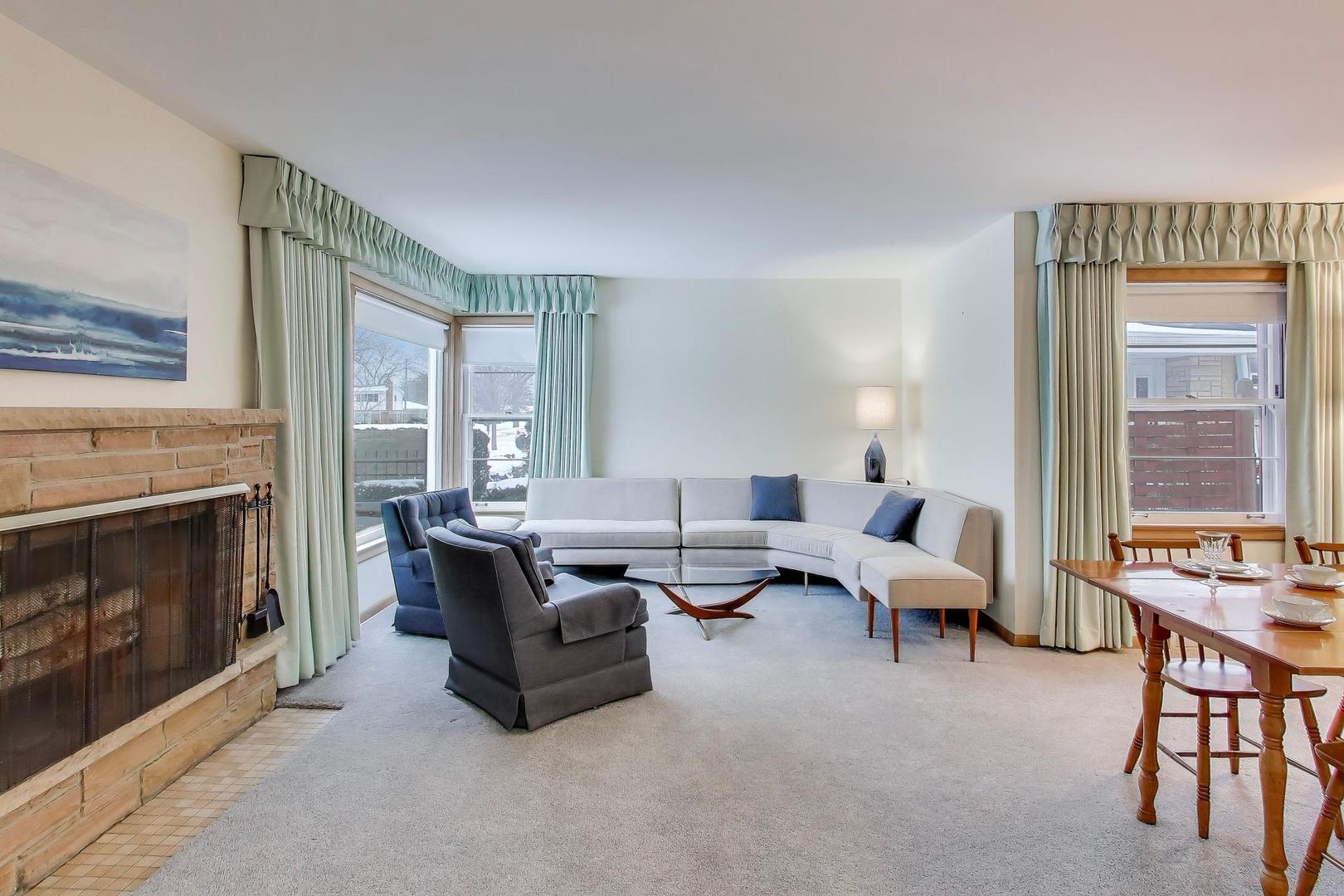 820 North Delphia Avenue Park Ridge, IL 60068 - Photo 3 of 24 a living room with furniture and a fireplace