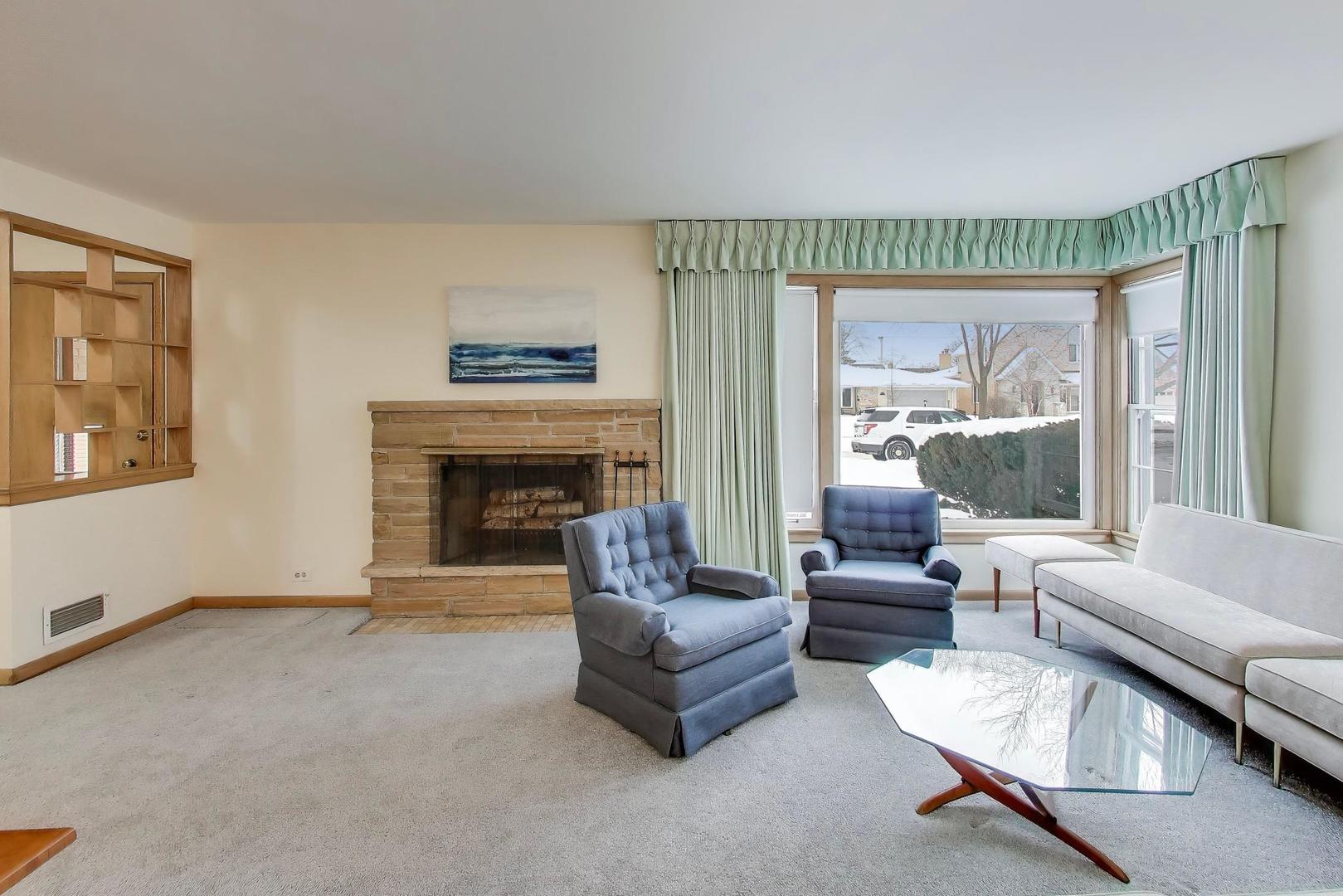 820 North Delphia Avenue Park Ridge, IL 60068 - Photo 4 of 24 a living room with furniture and a fireplace