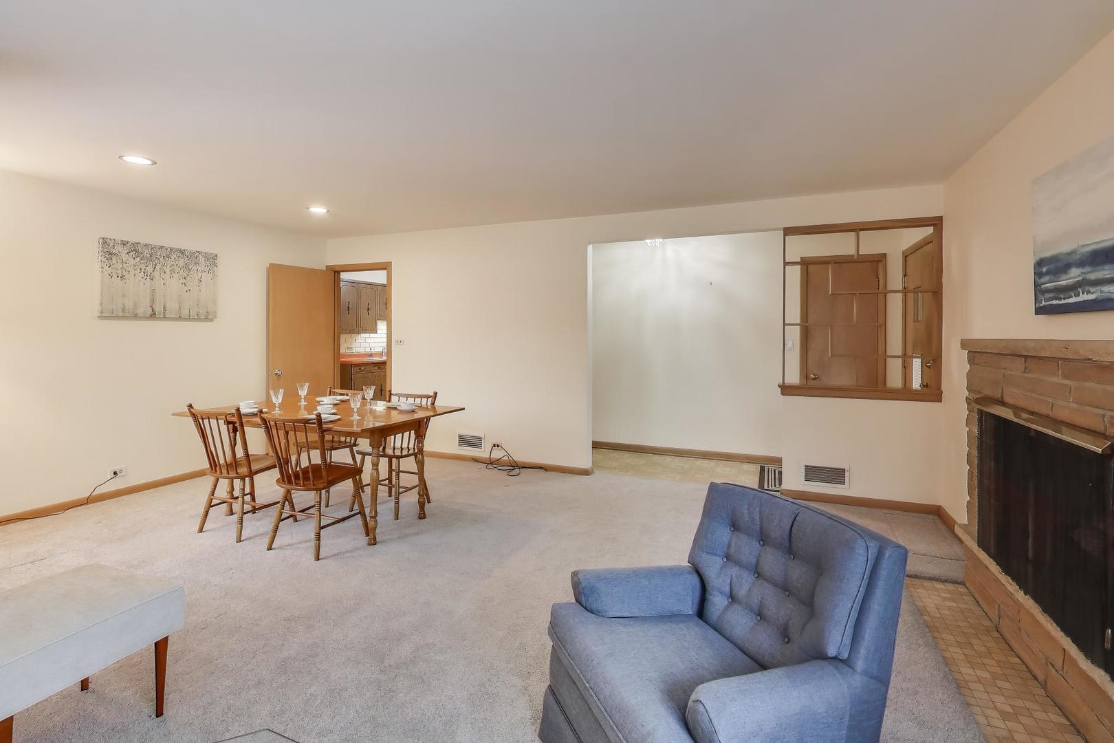 820 North Delphia Avenue Park Ridge, IL 60068 - Photo 5 of 24 a living room with furniture and a fireplace