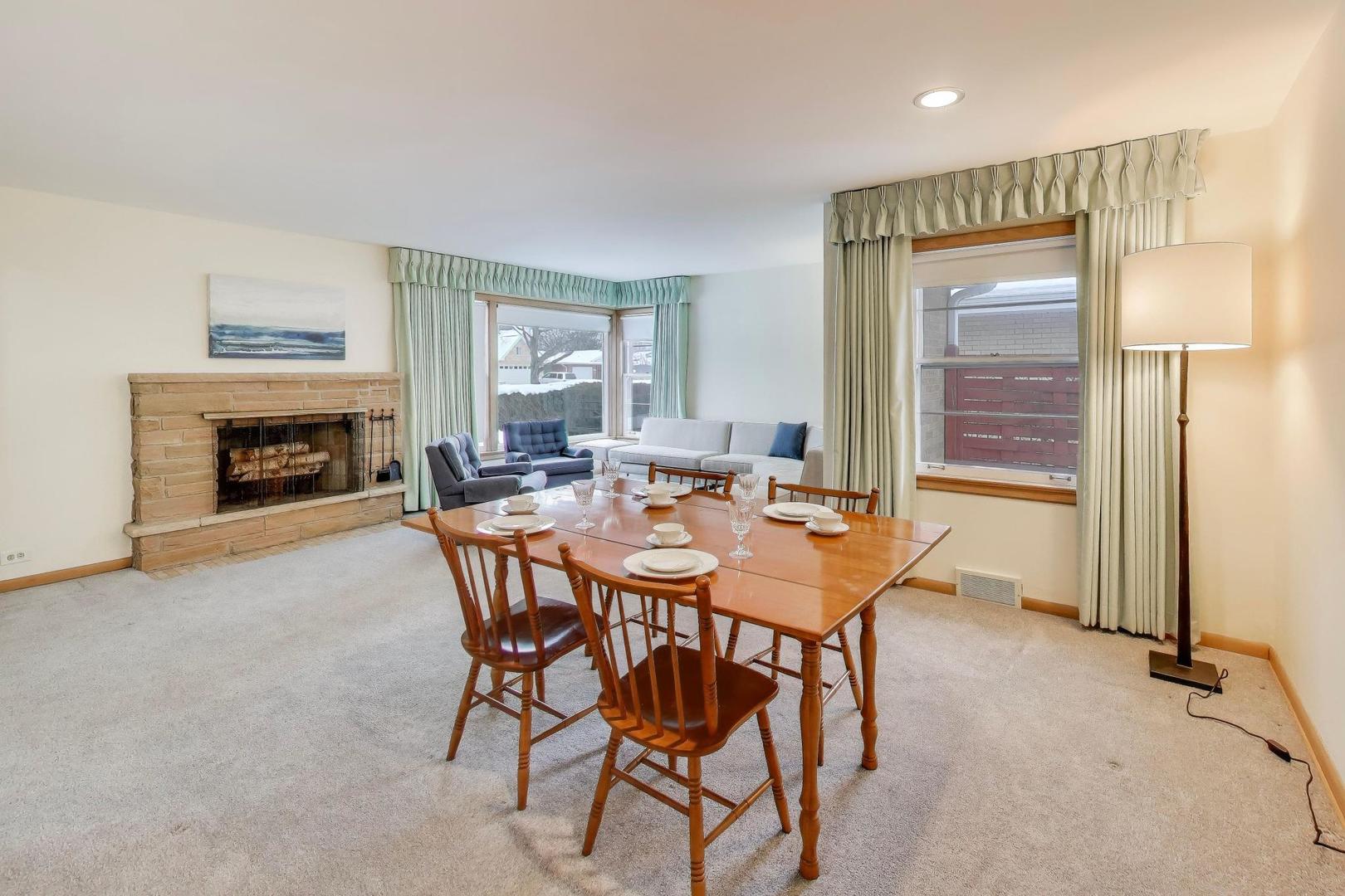 820 North Delphia Avenue Park Ridge, IL 60068 - Photo 7 of 24 a dining room with furniture and a fireplace
