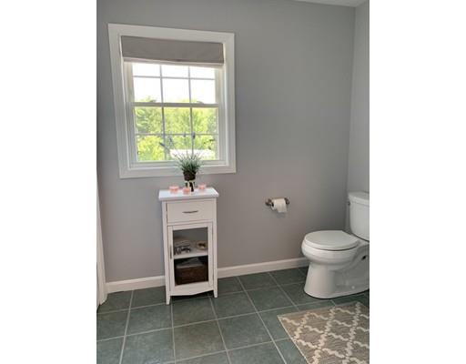 233 Pleasantdale Road Rutland, MA 01543 - Photo 23 of 41 a bathroom with a sink a toilet and a window