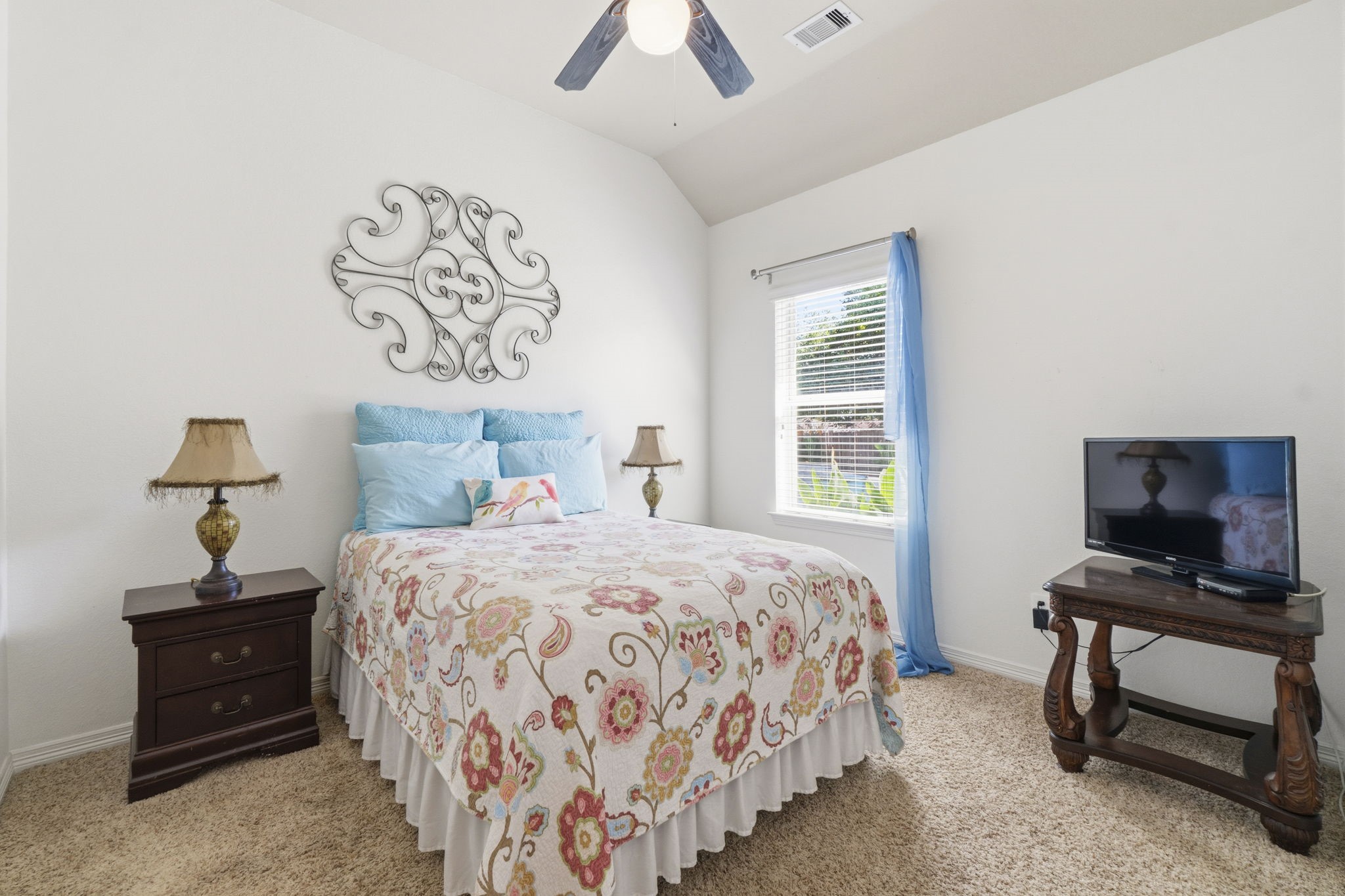 10802 Windswept Montgomery, TX 77356 - Photo 18 of 42 a bedroom with a bed and a window