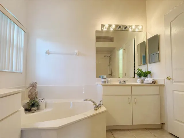 a bathroom with a bathtub and a sink