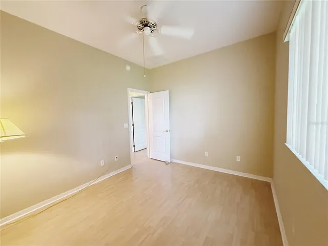 a bathroom with a sink a toilet a mirror and shower