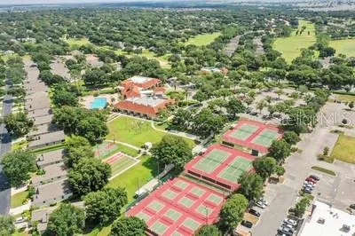 an aerial view of a house with yard swimming pool and outdoor seating