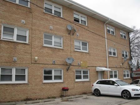 7531 Roberts Road, Unit 2B Bridgeview, IL 60455 - Photo 2 of 7 a cars parked in front of a building