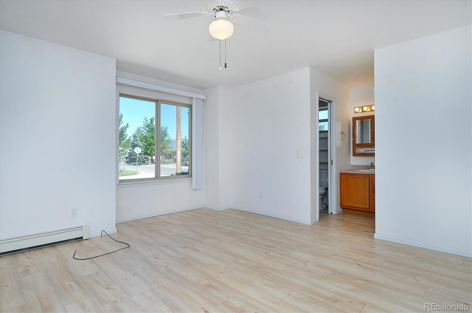 29 Rex Circle Salida, CO 81201 - Photo 20 of 31 wooden floor in an empty room with a window