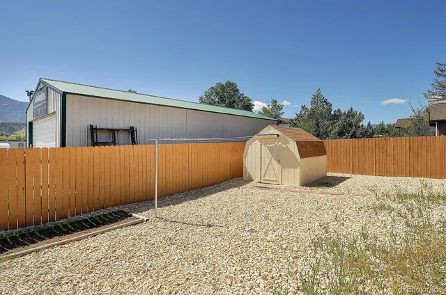 a view of a backyard of a house