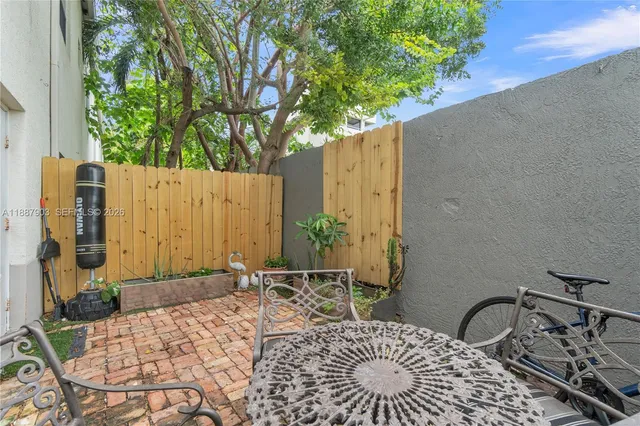 a wooden bench sitting in front of a building