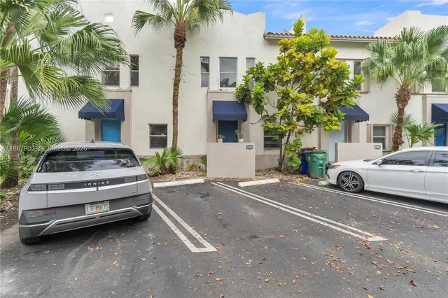 a view of a car parked in front of a house