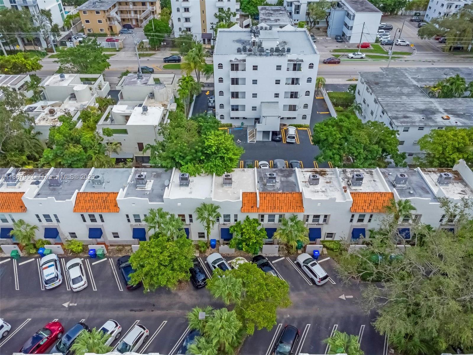 3067 Center Street, Unit 17 Miami, FL 33133 - Photo 21 of 21 an aerial view of a house with a garden and pool