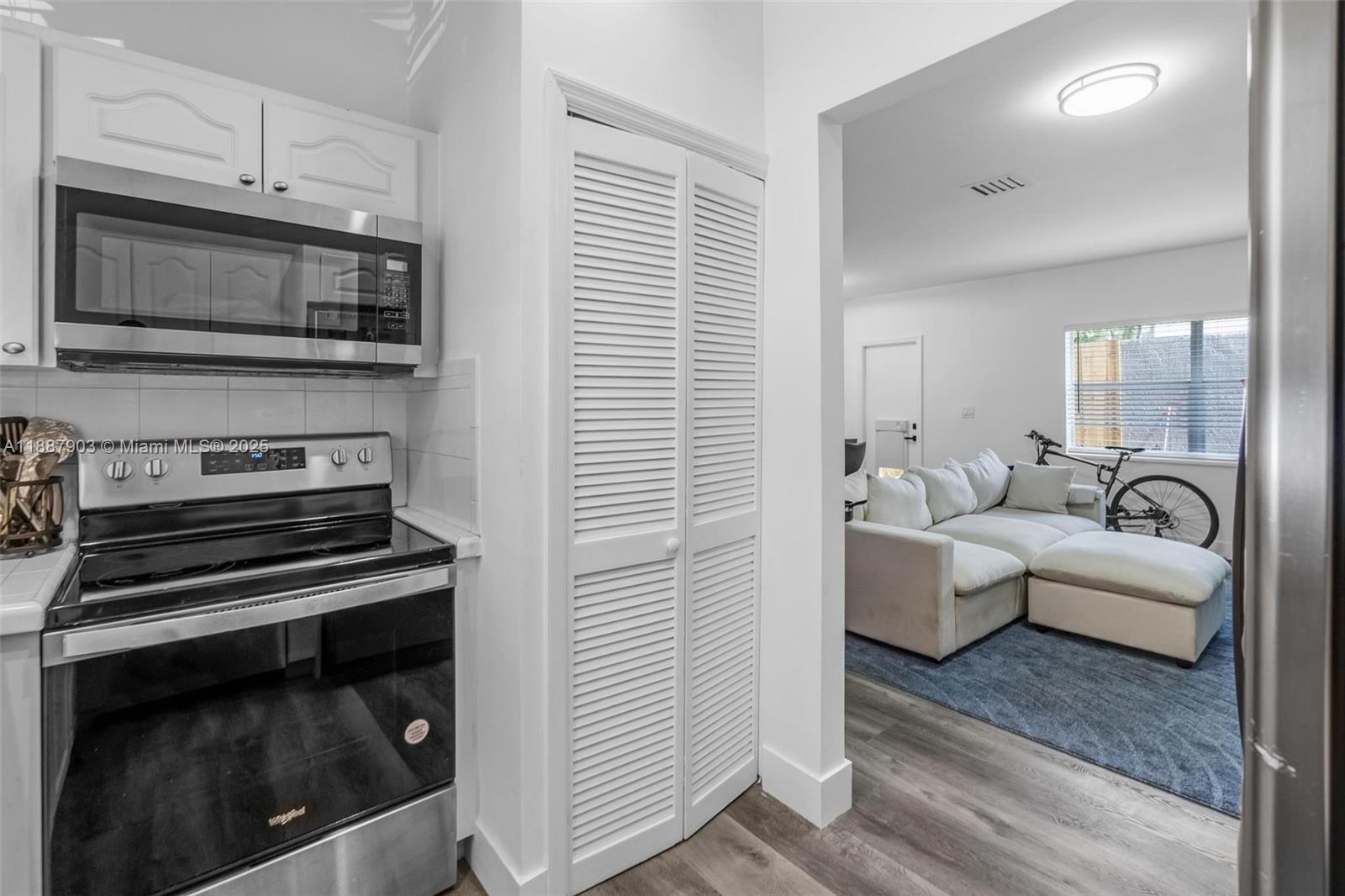 3067 Center Street, Unit 17 Miami, FL 33133 - Photo 4 of 21 a living room with furniture and a fireplace