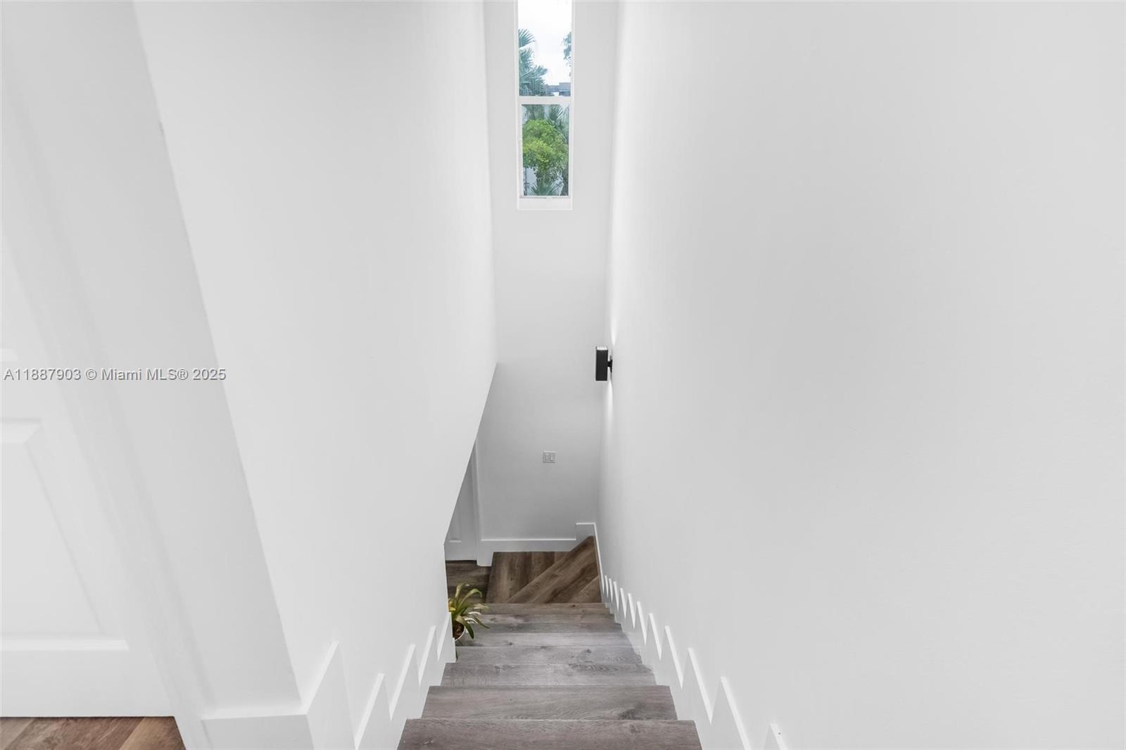 3067 Center Street, Unit 17 Miami, FL 33133 - Photo 7 of 21 a view of a hallway with staircase