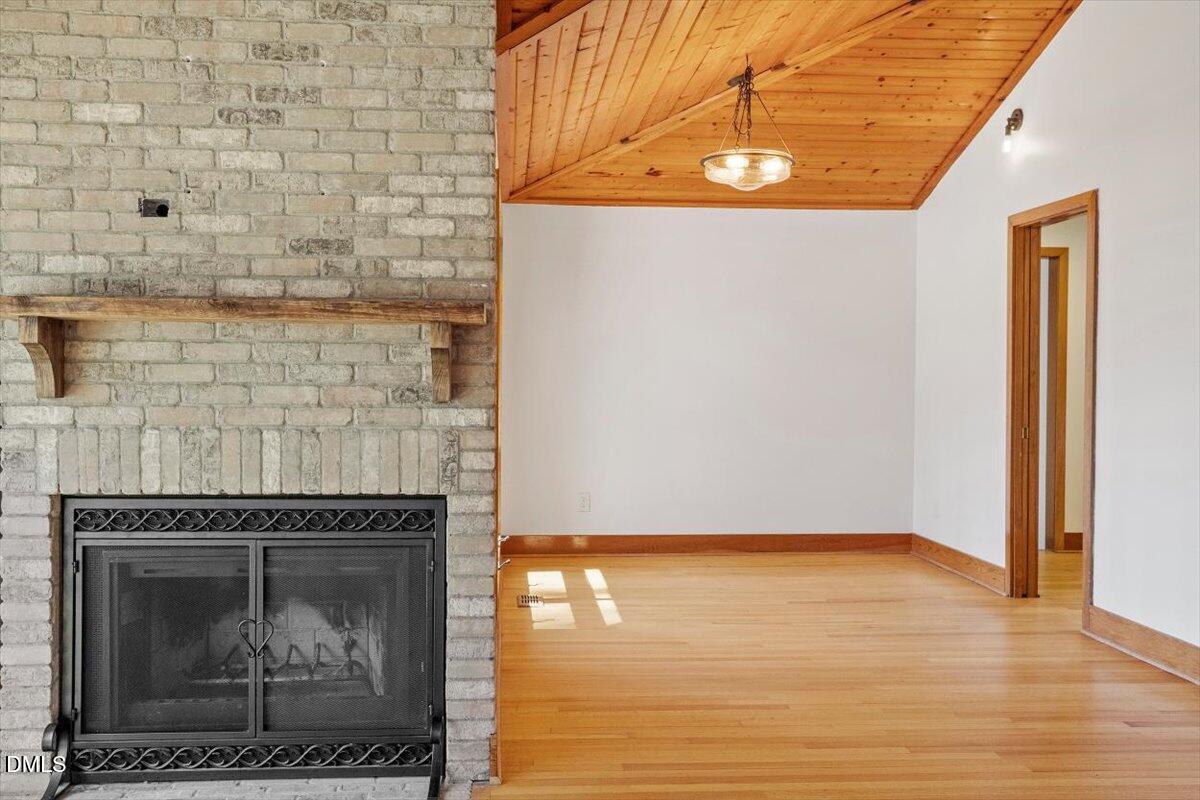 4805 Rembert Drive Raleigh, NC 27612 - Photo 13 of 45 a view of a fireplace in a room