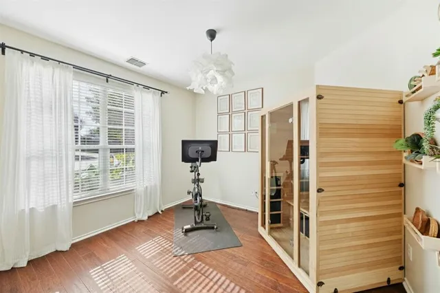a bedroom with furniture and a window