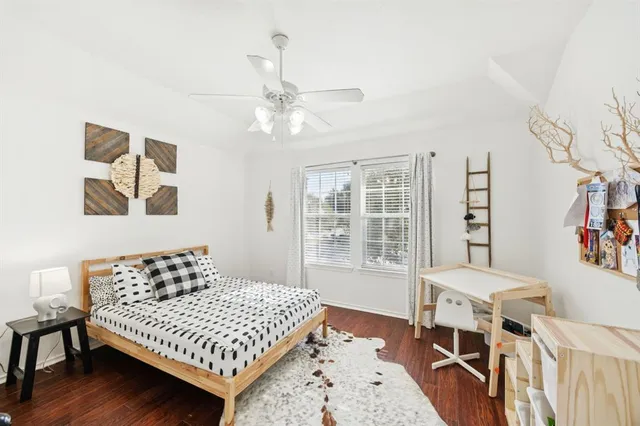 a bedroom with a bed furniture and a window
