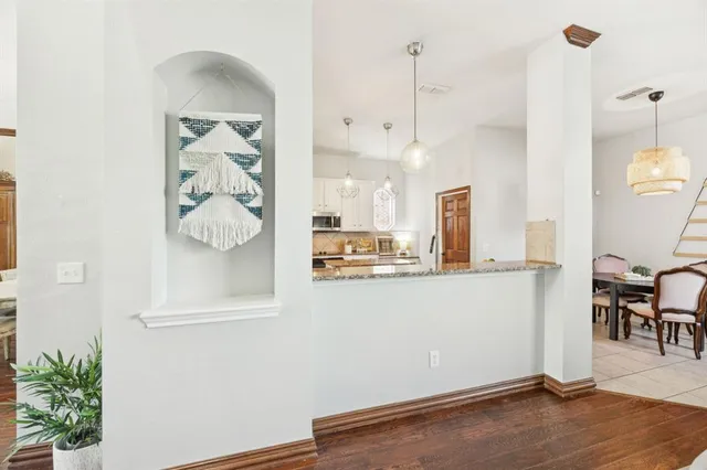 a view of kitchen with furniture and wooden floor