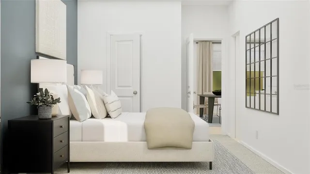 a bedroom with a bed and a cabinet