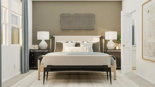 a bedroom with furniture and a potted plant