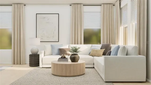 a living room with furniture and a large window