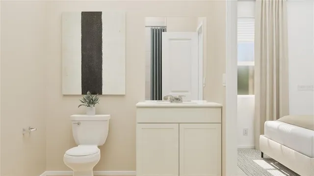 a bedroom with a bed and a mirror