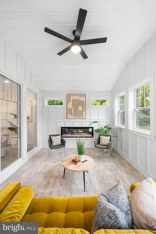 a view of room with window and wooden floor