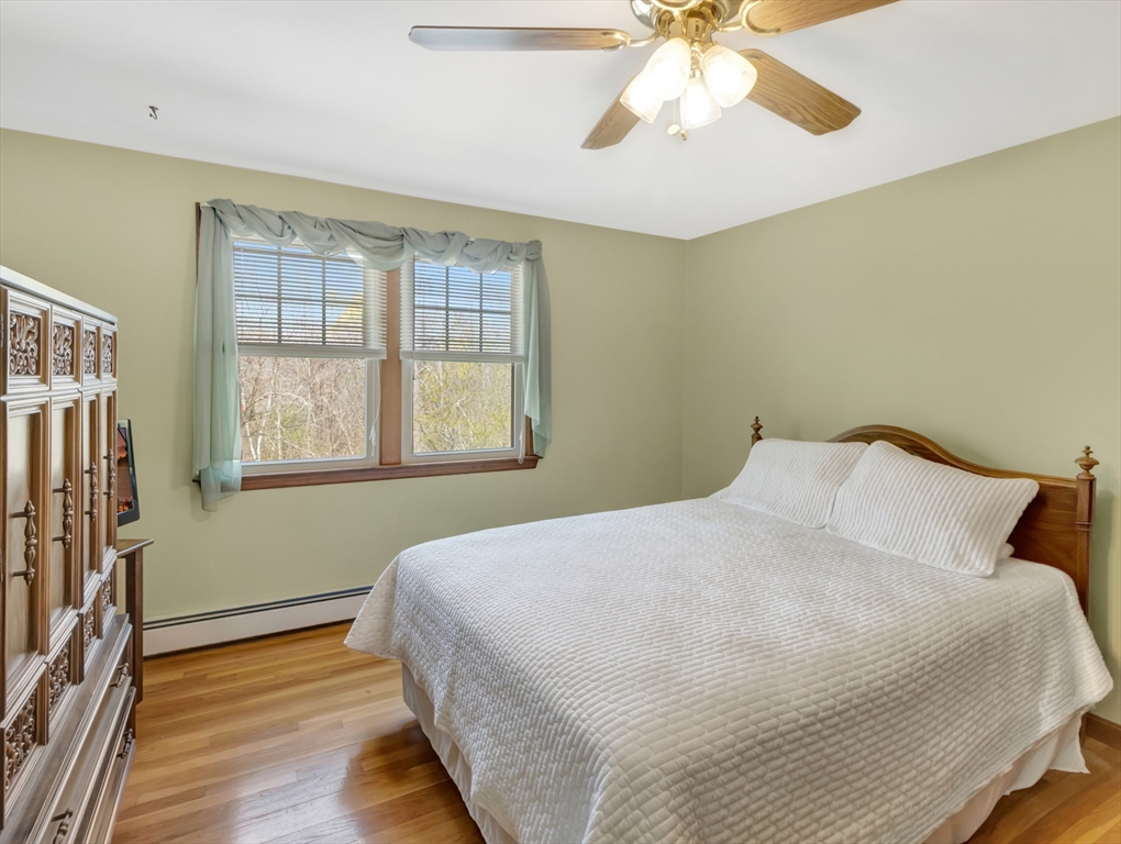 15 Riverside Drive Mansfield, MA 02048 - Photo 20 of 42 a bedroom with a bed and a window
