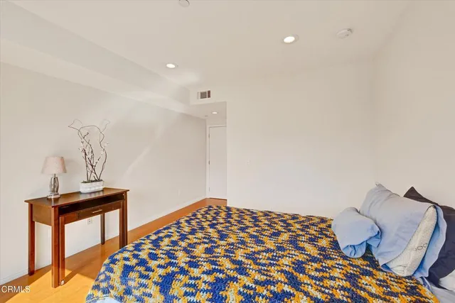 a bedroom with a bed and a table