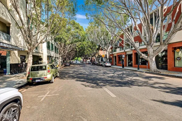 a view of a street with cars