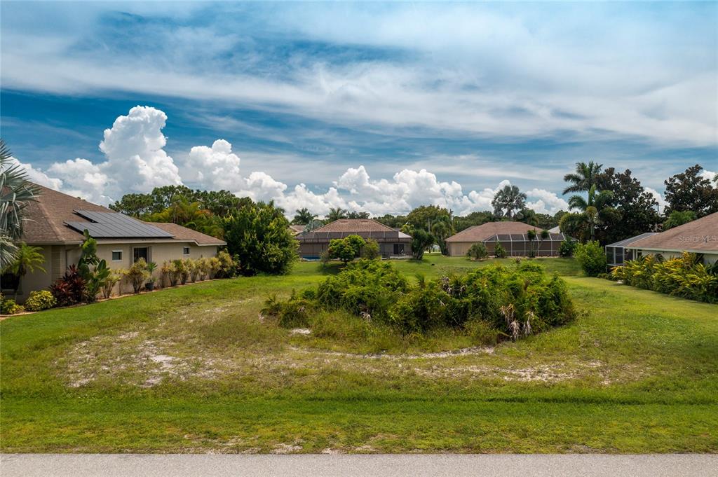 21 Medalist Way Rotonda West, FL 33947 - Photo 1 of 1 a front view of a house with a yard