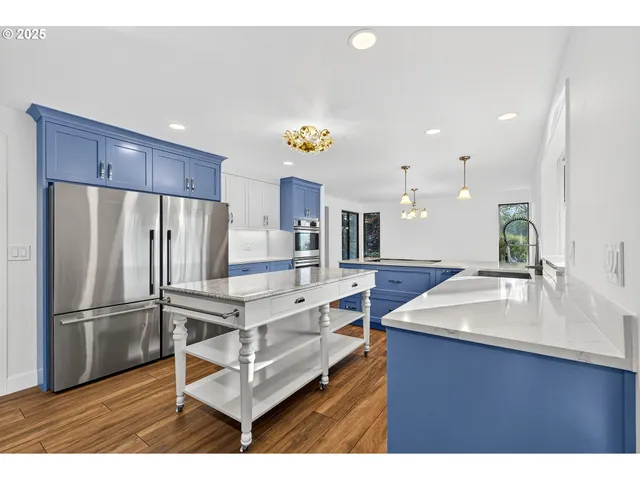 a kitchen with counter top space cabinets and stainless steel appliances