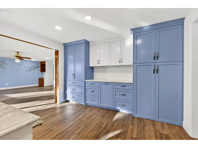 a view of room with window and hardwood floor