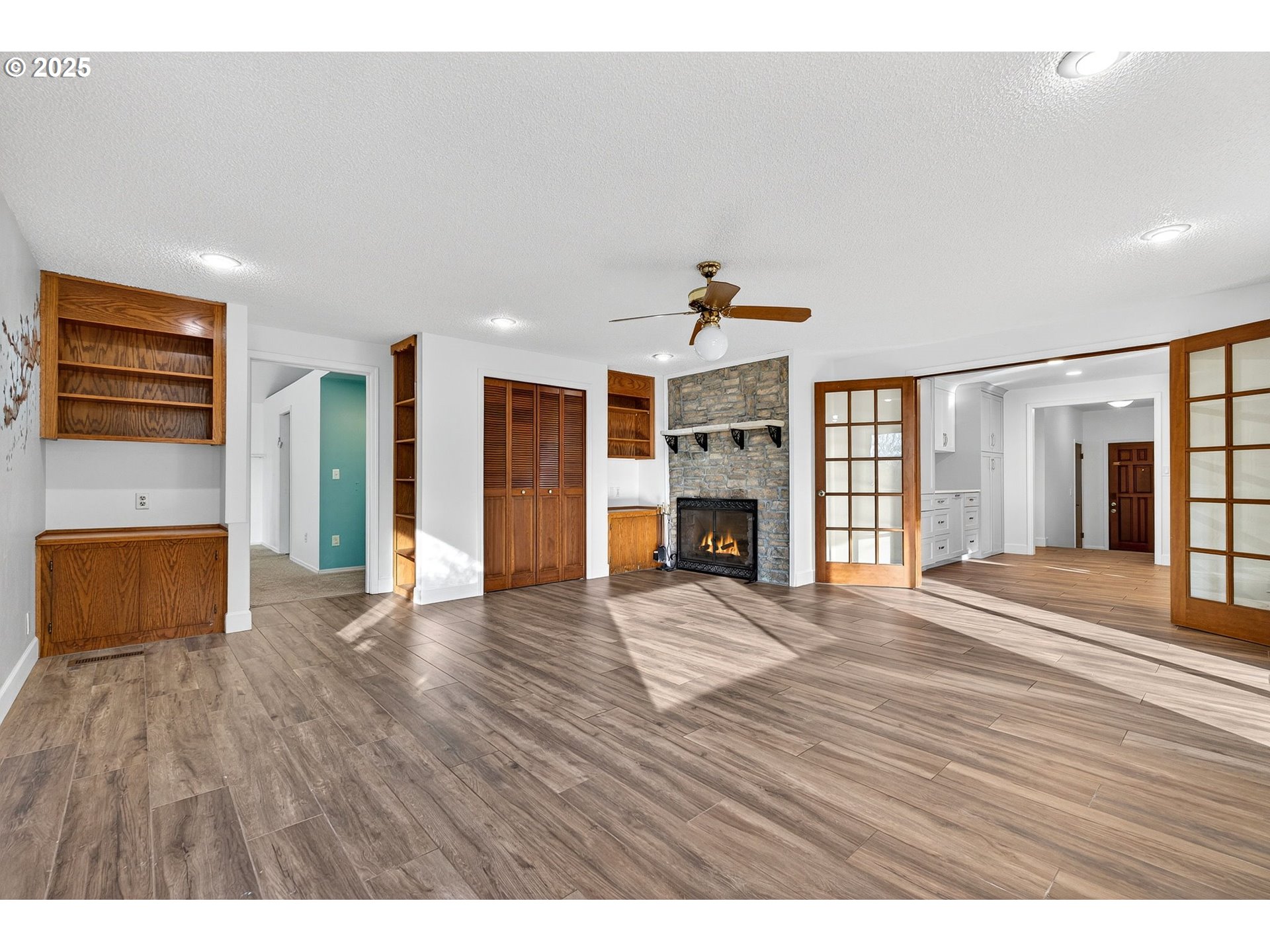 14595 Southwest 144th Avenue Portland, OR 97224 - Photo 22 of 43 a view of an empty room with wooden floor and a window