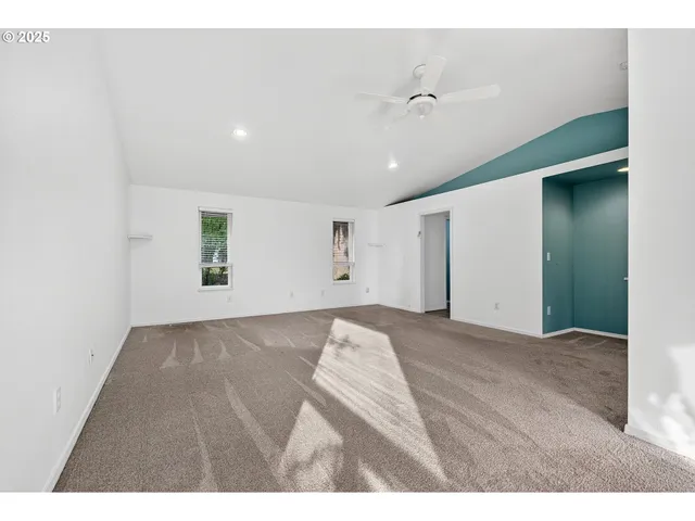 a bathroom with a tub a double vanity sink and a mirror