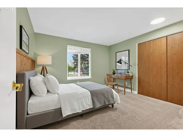 a bathroom with a sink a toilet a mirror and shower