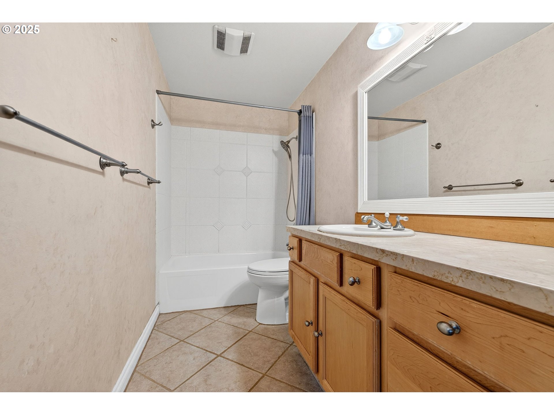14595 Southwest 144th Avenue Portland, OR 97224 - Photo 30 of 43 a bathroom with a sink a toilet a mirror and shower