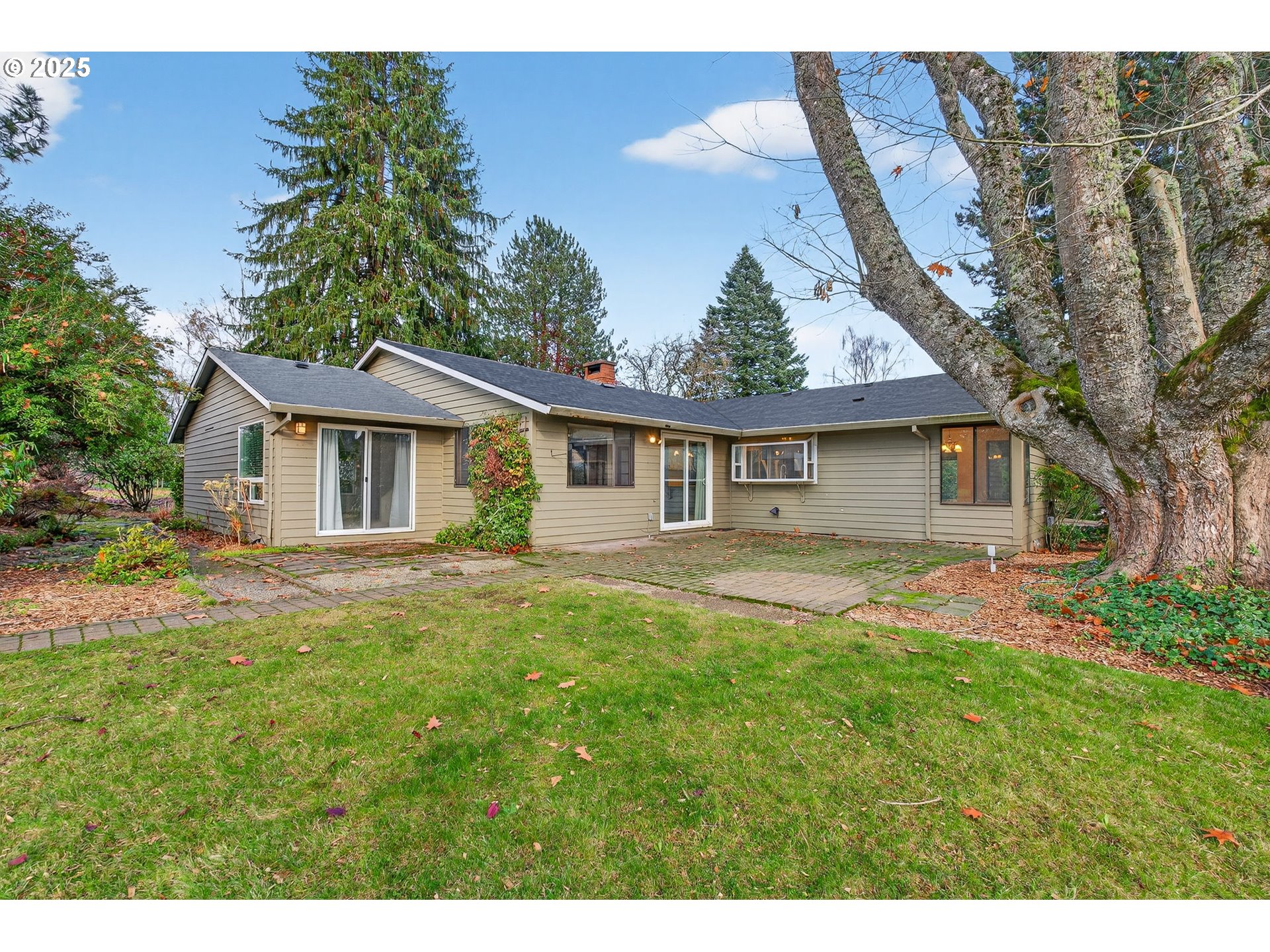 14595 Southwest 144th Avenue Portland, OR 97224 - Photo 40 of 43 a view of a house with a yard