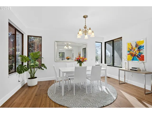 a dining room with furniture a livingroom and chandelier