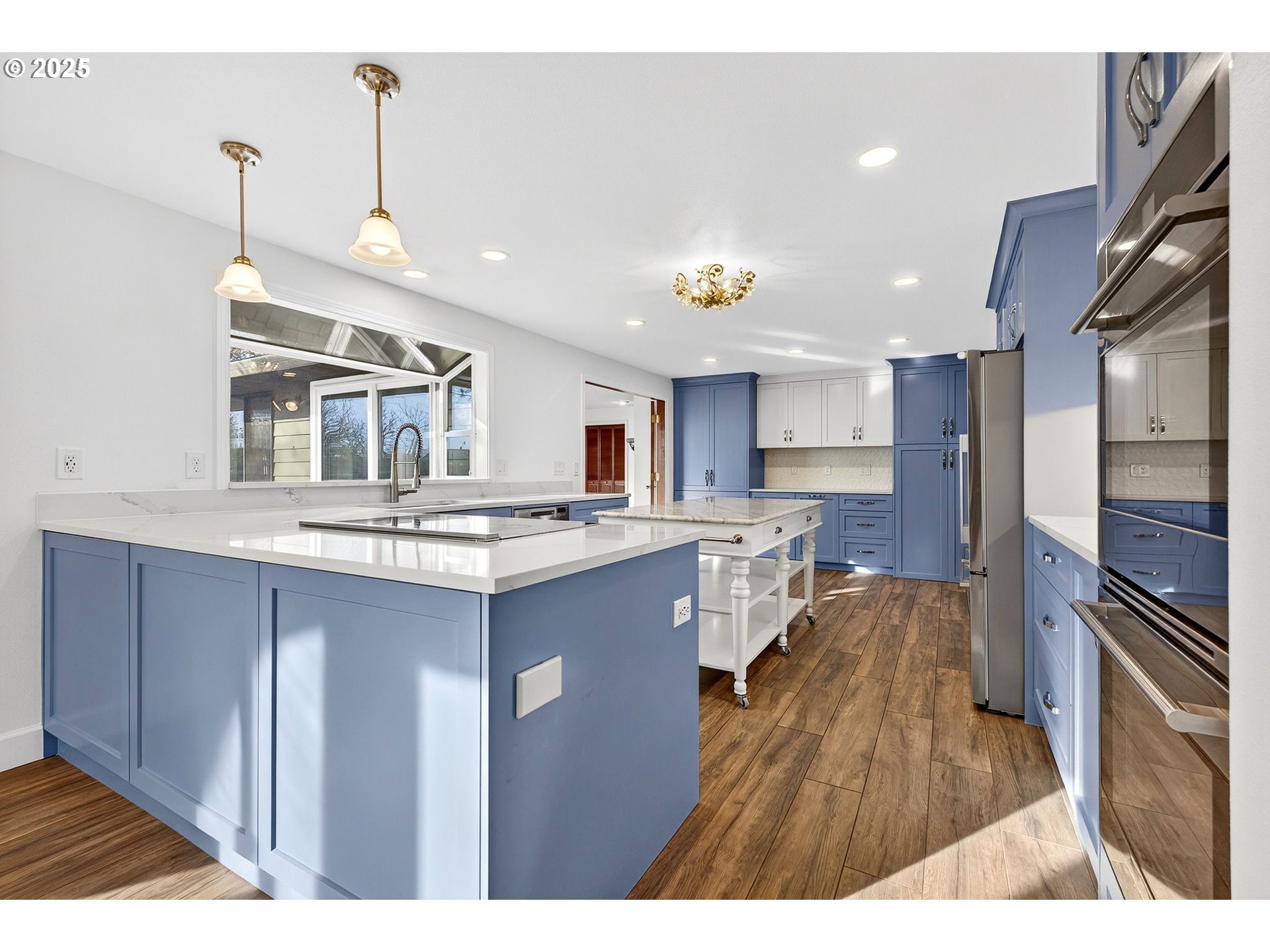 14595 Southwest 144th Avenue Portland, OR 97224 - Photo 8 of 43 a kitchen with stainless steel appliances granite countertop a sink stove and refrigerator